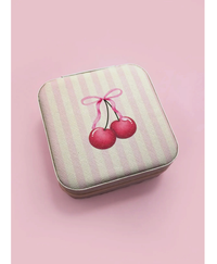 Travel jewelry box with pink and white stripes with a cherry and bow on a pink background
