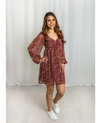 Women wearing a red floral dress with a sweatheart neckline
