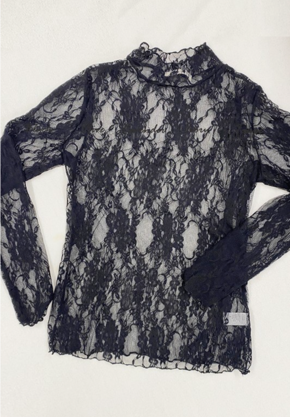 Black floral lace long-sleeve top with a mock neck on a white background