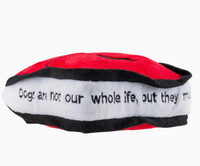 Red tote bag dog toy  side view showing the white side and the saying 'Dogs are not our whole life, but they make our lives whole' going around the sides of the toy