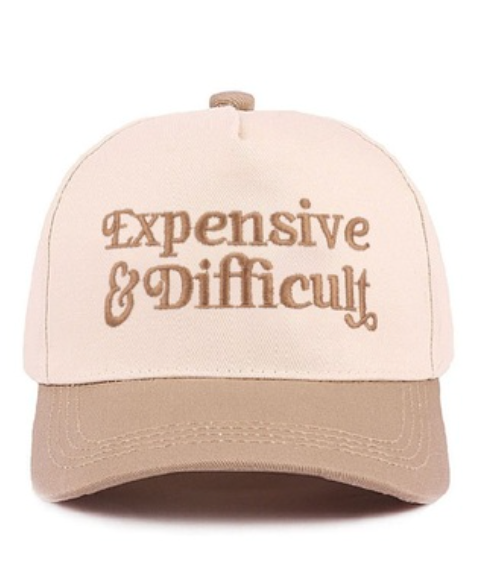 Beige cap with 'Expensive & Difficult' text on a white background