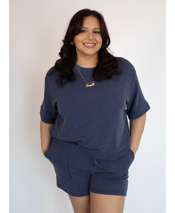 Woman wearing a short sleeve lounge set with matching shorts