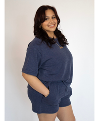 Woman wearing a short sleeve lounge set with matching shorts