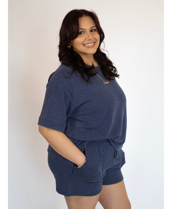 Woman wearing a short sleeve lounge set with matching shorts
